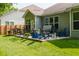 Landscaped backyard features a hot tub, grill, and ample seating on a concrete patio at 18973 Elder Ridge Dr, Noblesville, IN 46062