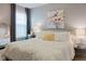 Bright bedroom with a white ruffled comforter, soft carpet, and elegant décor at 18973 Elder Ridge Dr, Noblesville, IN 46062