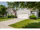 Charming home featuring a well-manicured lawn, two-car garage, and inviting curb appeal at 18973 Elder Ridge Dr, Noblesville, IN 46062