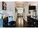 Hallway featuring gleaming hardwood floors and stylish decor at 18973 Elder Ridge Dr, Noblesville, IN 46062