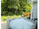 Relaxing hot tub on the patio is surrounded by green landscaping and mature trees at 18973 Elder Ridge Dr, Noblesville, IN 46062