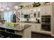 Bright kitchen featuring granite countertops, white cabinetry and stainless steel double oven at 18973 Elder Ridge Dr, Noblesville, IN 46062
