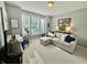 Sunlit living room with a comfortable sectional sofa, neutral carpet, and decorative accents at 18973 Elder Ridge Dr, Noblesville, IN 46062