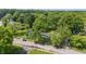 Beautiful aerial view of a home featuring lush greenery, mature trees, and well maintained landscaping at 1931 Brentwood Dr, Anderson, IN 46011