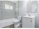Bathroom featuring a tiled shower-tub, toilet, and vanity with sink at 1931 Brentwood Dr, Anderson, IN 46011