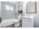Modern bathroom featuring sleek fixtures, a soaking tub, and stylish vanity at 1931 Brentwood Dr, Anderson, IN 46011