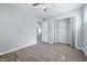 Bedroom with gray wood-look flooring, ceiling fan, and closet with shelving at 1931 Brentwood Dr, Anderson, IN 46011