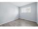 Cozy bedroom featuring hardwood floors, a window for natural light, and fresh paint at 1931 Brentwood Dr, Anderson, IN 46011