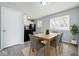 Cozy dining area with modern table, seating, and natural light, adjacent to the kitchen at 1931 Brentwood Dr, Anderson, IN 46011