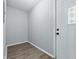 Clean entryway with hardwood floors, fresh paint, and a door with decorative glass insert at 1931 Brentwood Dr, Anderson, IN 46011