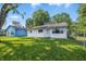 Charming single-story home with lush green lawn and mature trees at 1931 Brentwood Dr, Anderson, IN 46011