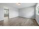 Bright, open living room featuring new hardwood floors, fresh paint, and ample natural light at 1931 Brentwood Dr, Anderson, IN 46011