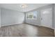 Inviting living room with hardwood floors, a front door, and a large window for plenty of natural light at 1931 Brentwood Dr, Anderson, IN 46011