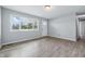 Bright living room featuring hardwood floors and a large window with views of the neighborhood at 1931 Brentwood Dr, Anderson, IN 46011
