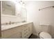Bathroom featuring double sinks, marble countertops and floors, and bright lighting at 196 Park Ave, Bargersville, IN 46106