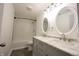 Bathroom featuring double sinks, marble countertops, oval mirrors, and shower at 196 Park Ave, Bargersville, IN 46106