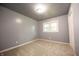 Bedroom with neutral carpet, white trim, gray walls, and bright natural light at 196 Park Ave, Bargersville, IN 46106