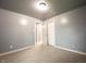 Bedroom with neutral carpet, white trim, gray walls, and interior door at 196 Park Ave, Bargersville, IN 46106