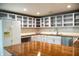 Bright kitchen features stainless steel appliances, white cabinets, and a large island at 196 Park Ave, Bargersville, IN 46106
