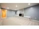 Inviting living room with a whitewashed fireplace and neutral color palette at 196 Park Ave, Bargersville, IN 46106