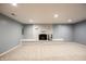 Cozy living room featuring a painted brick fireplace and neutral carpeting at 196 Park Ave, Bargersville, IN 46106