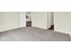 This carpeted bedroom provides access to a modern kitchen and bathroom enhancing the property's appeal at 2021 Frost Line Ln, Greenfield, IN 93927