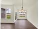 Bright dining room with modern chandelier and view of backyard at 2021 Frost Line Ln, Greenfield, IN 93927