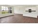 Bright, open layout showcasing a modern kitchen with an island, stainless steel appliances, and wood flooring at 2021 Frost Line Ln, Greenfield, IN 93927