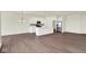 Open floor plan with a modern kitchen island, stainless steel appliances, and wood floors throughout at 2021 Frost Line Ln, Greenfield, IN 93927