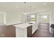Open-concept kitchen with a large island, stainless steel appliances, and seamless integration with the living area at 2021 Frost Line Ln, Greenfield, IN 93927