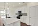 Modern kitchen featuring white cabinets, stainless steel appliances, and a quartz island perfect for entertaining at 2021 Frost Line Ln, Greenfield, IN 93927