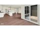 Open concept living room leading to a kitchen and outdoor patio at 2021 Frost Line Ln, Greenfield, IN 93927