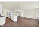 Open concept kitchen and living room with modern lighting and hardwood floors at 2021 Frost Line Ln, Greenfield, IN 93927