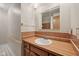 Bathroom featuring a sink with wood cabinetry and a medicine cabinet for storage at 230 Love Ave, Greenwood, IN 46142