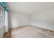 Neutral bedroom with plush carpeting, soft natural light, and minimalist design at 230 Love Ave, Greenwood, IN 46142