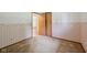 Empty carpeted bedroom featuring a small window, two tone wallpaper, and tan carpet at 230 Love Ave, Greenwood, IN 46142