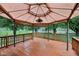 Outdoor deck featuring wood flooring, gazebo covering, and views of backyard at 230 Love Ave, Greenwood, IN 46142