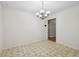 Dining area with chandelier lighting and neutral walls adjacent to the kitchen at 230 Love Ave, Greenwood, IN 46142