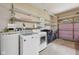 Garage space features storage shelves, and laundry machines at 230 Love Ave, Greenwood, IN 46142