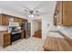 Functional kitchen with stainless appliances, and wood cabinets, offering practical cooking space at 230 Love Ave, Greenwood, IN 46142