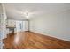 Open living space with hardwood floors, white walls, built-in desk, and additional storage at 230 Love Ave, Greenwood, IN 46142