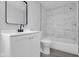 Bathroom featuring a black framed mirror and shower with marble tiling at 26098 Six Points Rd, Sheridan, IN 46069