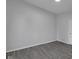 Gray bedroom features new paint, gray flooring at 26098 Six Points Rd, Sheridan, IN 46069