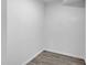 Small storage closet featuring gray wood-look flooring and white walls at 26098 Six Points Rd, Sheridan, IN 46069