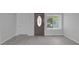 Entryway with modern wood-look flooring and a window for natural light at 26098 Six Points Rd, Sheridan, IN 46069
