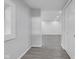 Hallway featuring gray flooring leading into other parts of the home at 26098 Six Points Rd, Sheridan, IN 46069