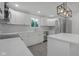 Bright kitchen features white cabinetry, stainless steel appliances, and island with quartz countertops at 26098 Six Points Rd, Sheridan, IN 46069