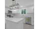 Bright kitchen features white cabinetry, stainless steel appliances, and island with quartz countertops at 26098 Six Points Rd, Sheridan, IN 46069