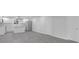 Open floorplan leads to bright kitchen with white cabinetry and stainless appliances at 26098 Six Points Rd, Sheridan, IN 46069