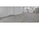 Open floorplan leads to bright kitchen with white cabinetry and stainless appliances at 26098 Six Points Rd, Sheridan, IN 46069